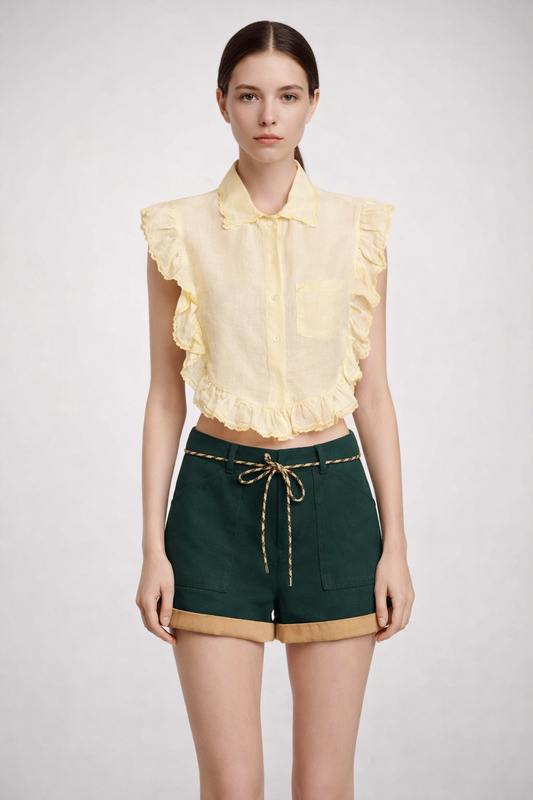 Jasnożółta bluzka bez rękawów z falbanami i zapięciem na guziki